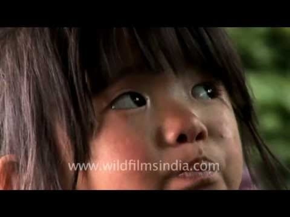 Cute little Naga girl selling live worms, Kohima