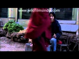 Tibetan boy selling bread