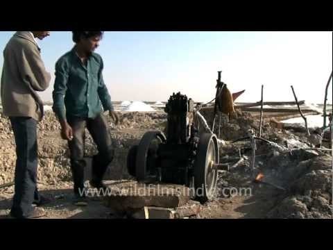 Struggling with an antique pump to draw ground water...