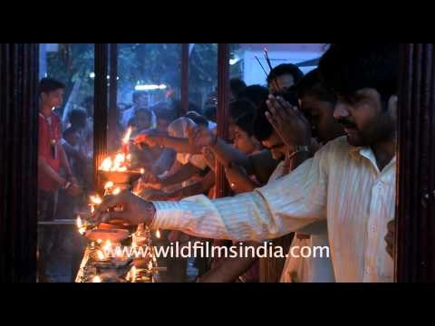 Devotees lighting lamps in Kamakhya temple