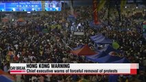 Hong Kong protests enter third week, leader warns of force