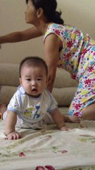 Baby boy learns how to crawl