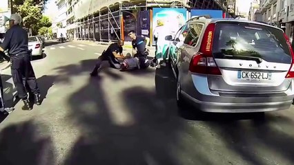In France he takes out his gun in front of the cops!