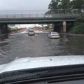 Vehicles drive through flooded underpass in Lindenhurst, NY