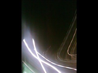 The haunting blues from downtown sizzling streetlights