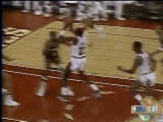 Micheal Jordan Dunks Over Two Players