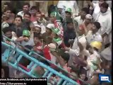 PAT workers capture armed man during Tahir ul Qadri speech