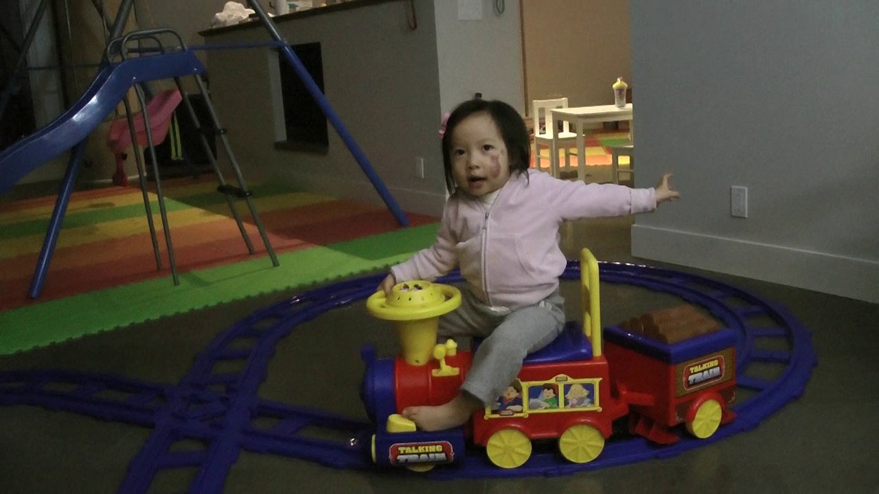 Girl And Toy Train