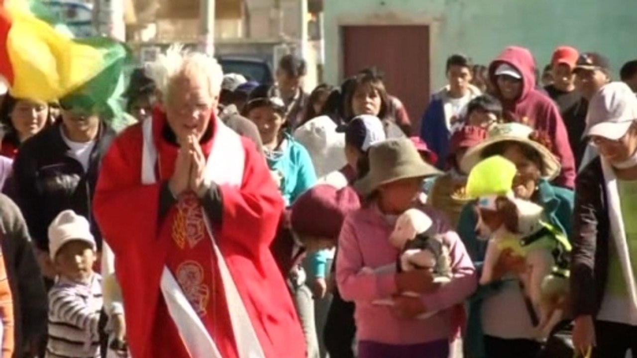 Bolivian priest blesses beloved pups