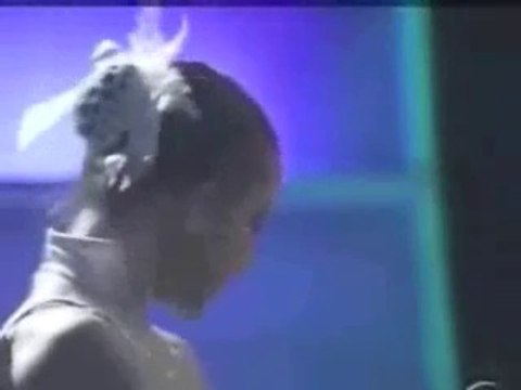 Girl shoots bow with her feet