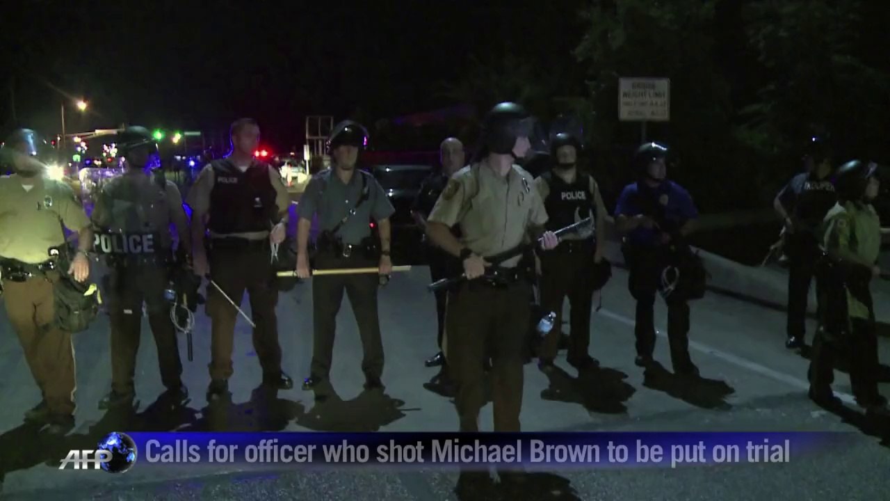 Police hold back on tear gas at Ferguson protest