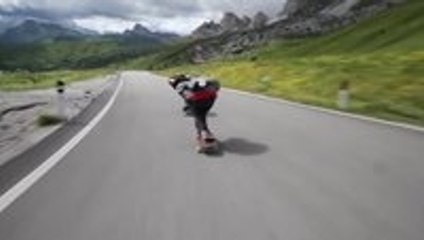 Skateboarders Racing cyclists in the ALPS