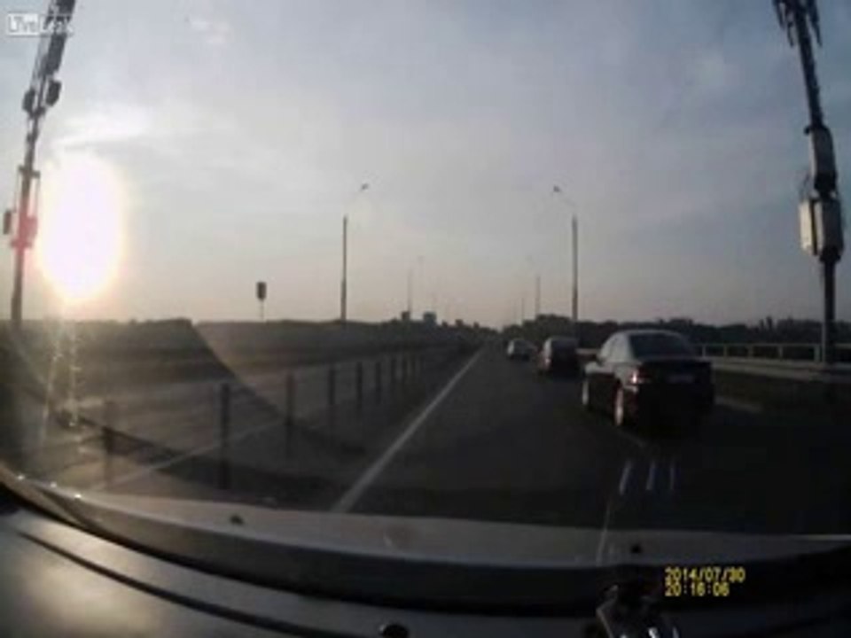 Motorcyclist Makes Insane Landing on roof of car After Crash