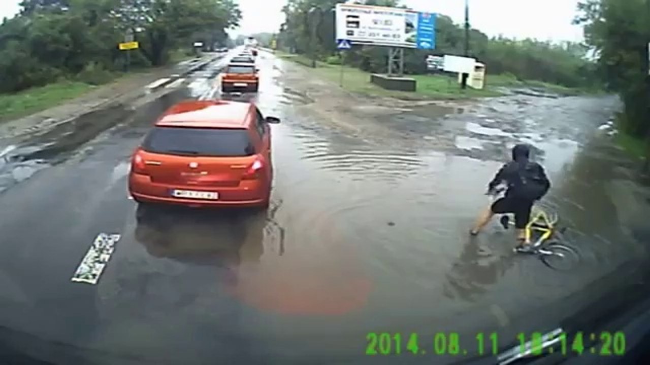 Poland cyclist faceplant in puddle