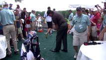 Golf player Phil Mickelson hit a shot out of the hospitality tent