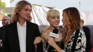 Miley Cyrus and Date Jesse on the 2014 MTV VMAs Red Carpet