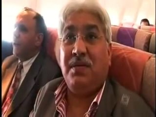 Riaz Khan with Benazir Bhutto travelling by Emirates from Dubai.