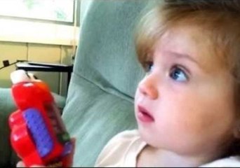 Little Girl Delights at Rocket Launch on TV
