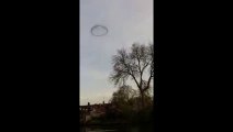 Schoolgirl videos strange black ring in the sky