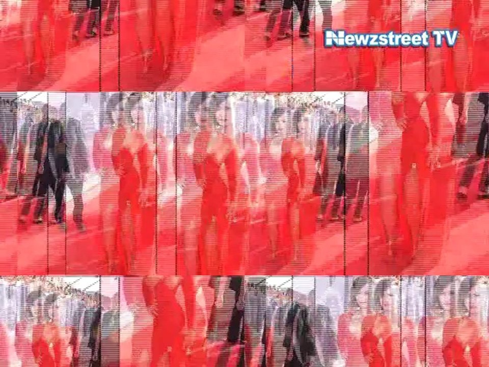 Demi Lovato walks the red carpet in a cleavage baring gown