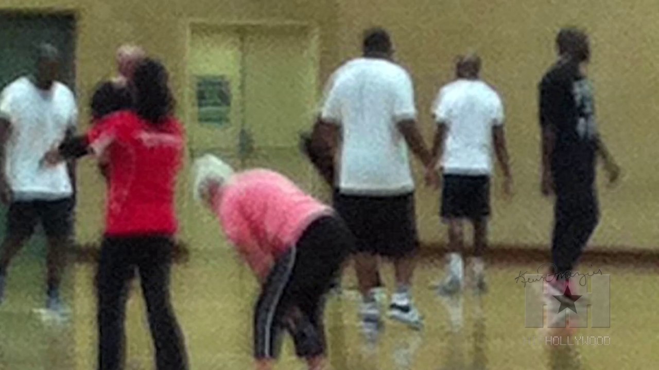 Kanye shows off his man boobs and basketball skills in Australia