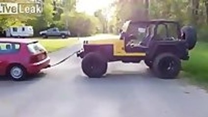 Little Honda towing a Jeep