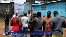 Relatives of Ebola victims wait for news at Liberia hospital