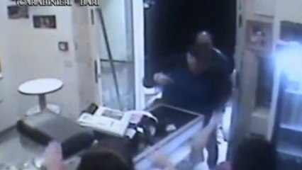 Pizza man hurls plates at armed robbers to defend his shop