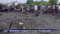 Bomb attacks in Baghdad kill at least 19 as Kerry visits