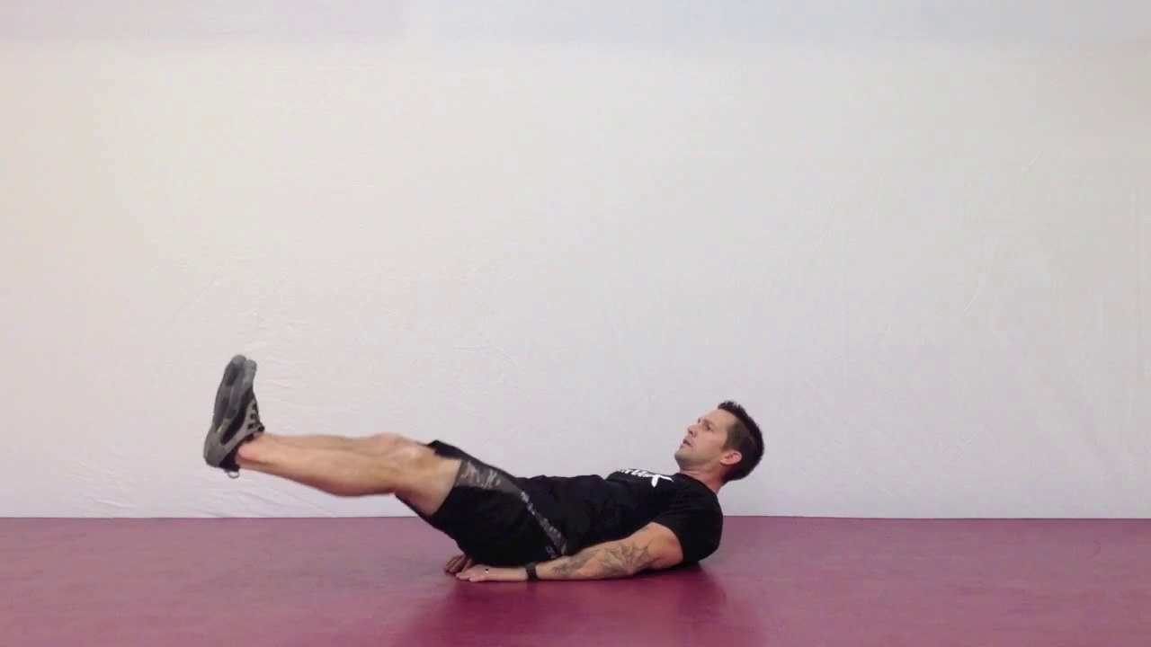 Evde egzersiz - Lying Knee Tucks - Fitekran.com