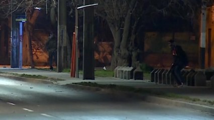 Demonstrators clash with police on the anniversary of Pinochet coup