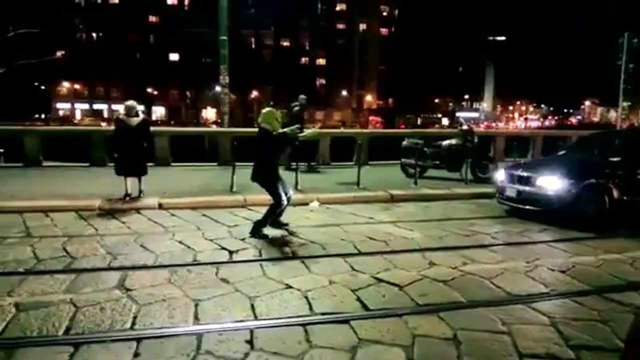 Alien lends a helping hand to older pedestrian