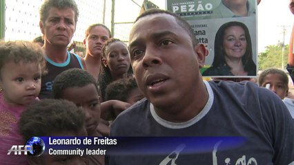 Rousseff in Rio slum visit as poll gap closes
