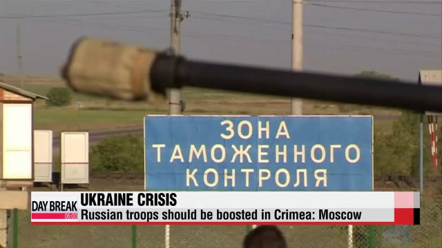 Russia's defense minister indicates need for more troops in Crimea