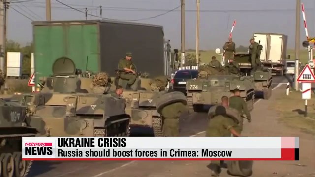 Russia's defense minister indicates need for more troops in Crimea