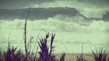 Kelly Slater and Joel Parkinson surfing big waves in Praia do Norte Nazare