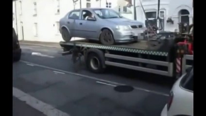 Download Video: Crazy Driver crashing his car stuck on a tow truck!