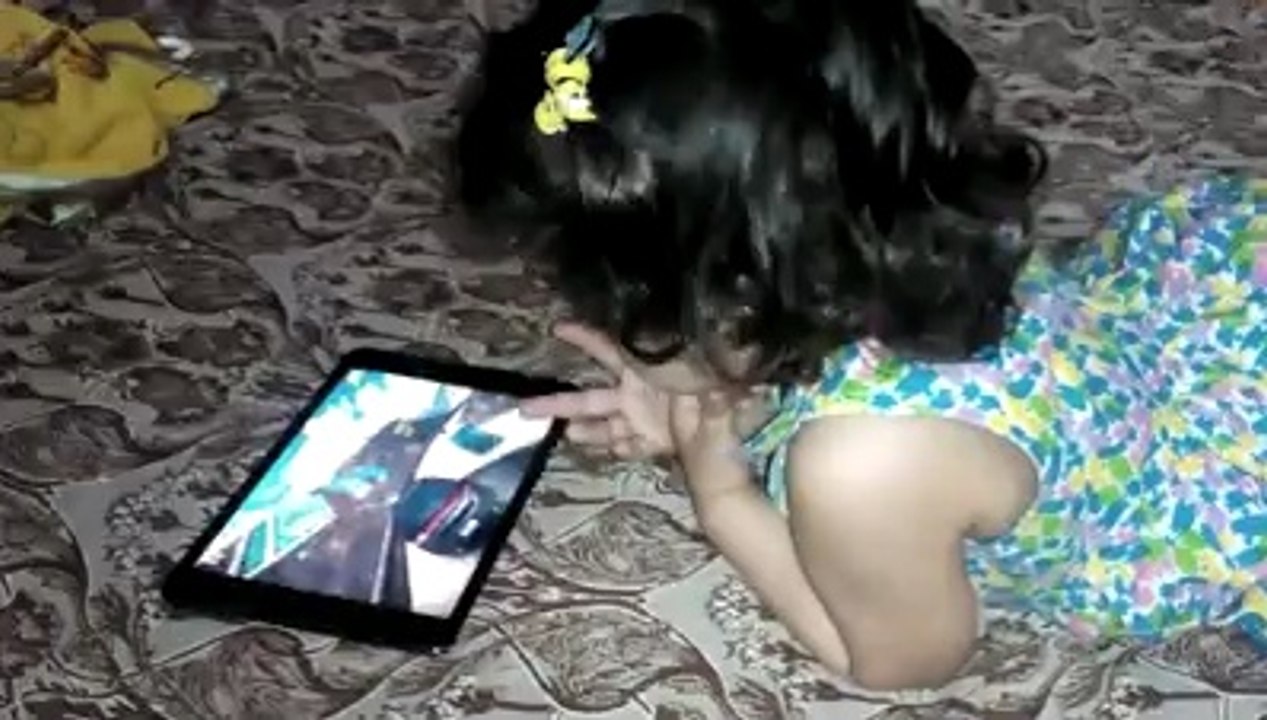 Kid enjoying Asphalt 8 on my iPad