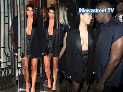 Kim Kardashian impresses in tuxedo jacket sneaking assets