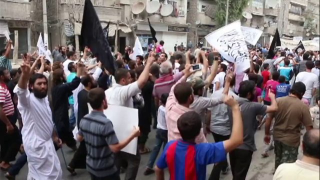 Al-Nusra Front supporters demonstrate against the US coalition