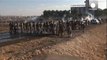 Turkish Kurds clash with police on border with Syria as Syrian Kurds stream into Turkey