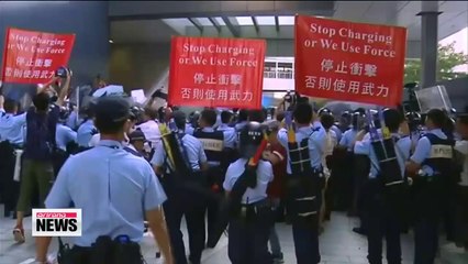 Pro-democracy sit-ins in Hong Kong persist into early Monday