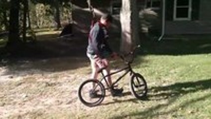 BMX stunds using a bike swing