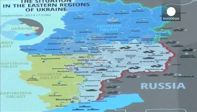 Украина: бои за аэропорт Донецка и полемика вокруг массовых захоронений