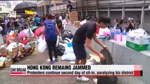 Massive pro-democracy sit-ins paralyze Hong Kong for 2nd day