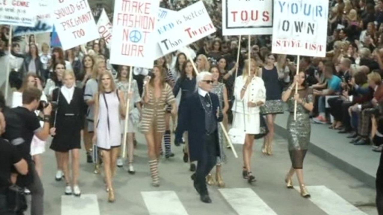 Chic "protesters" take Boulevard Chanel at Paris Fashion Week