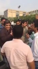 Hanif Abbasi between PTI supporters