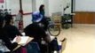 Professor Teaches Students Using a Fire Extinguisher and a Tricycle