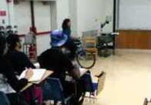 Professor Teaches Students Using a Fire Extinguisher and a Tricycle