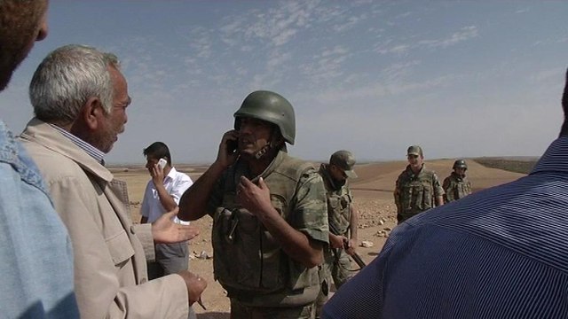 REPORTAGE- A la frontière turque, les Kurdes assistent au siège de Kobané